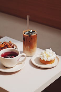 A stylish display of coffee and dessert on a café table, perfect for culinary lovers.
