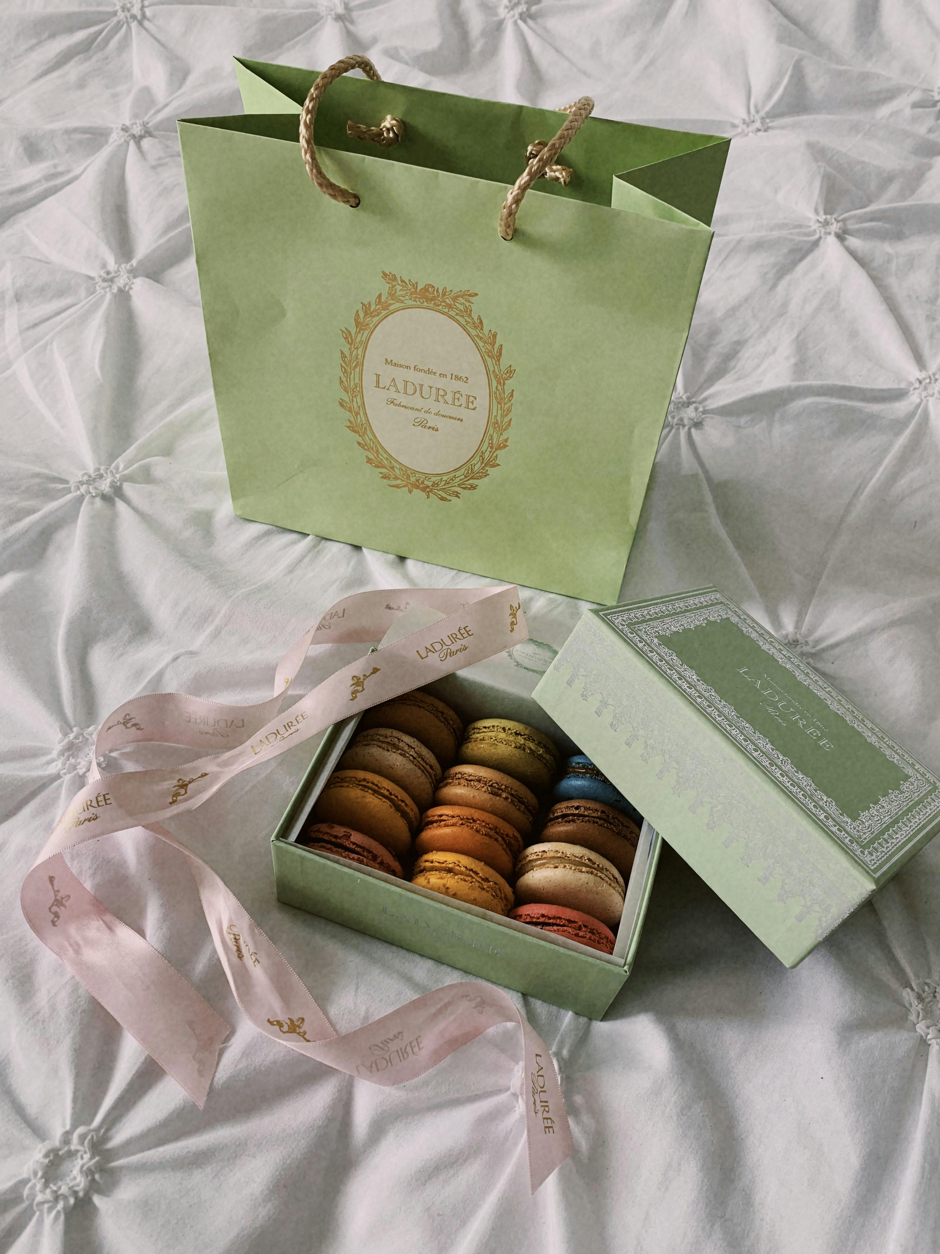 Laduree macarons displayed beautifully in Paris packaging.