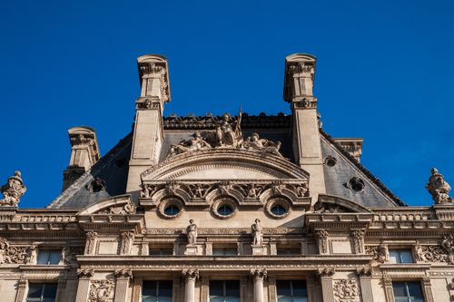 Free Detailed view of the Louvre Museum's Renaissance architecture in Paris, France. Stock Photo