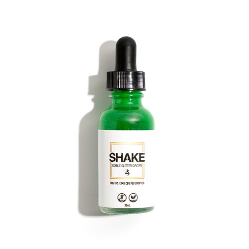 Free Edible glitter drops bottle for cannabis enthusiasts. Stock Photo