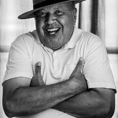 Smiling mature Latino man customer portrait