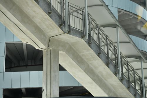 Free Close-up view of concrete and metal urban architecture showcasing geometric design elements. Stock Photo