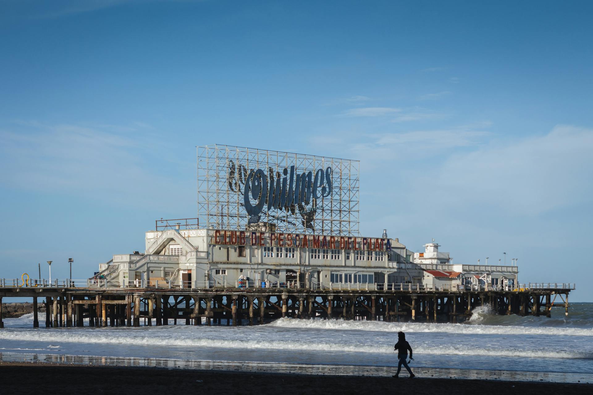 A coastal scene featuring the iconic pier and club in Mar del Plata, Argentina.