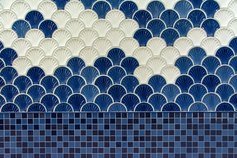 Close-up of expert bathroom tile installation in Sydney