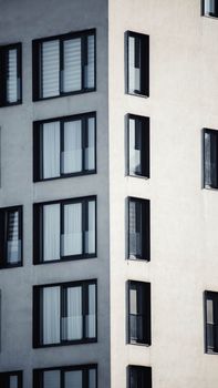 Stylish minimalist facade of modern building with geometric window patterns in Ilidža, Bosnia and Herzegovina.