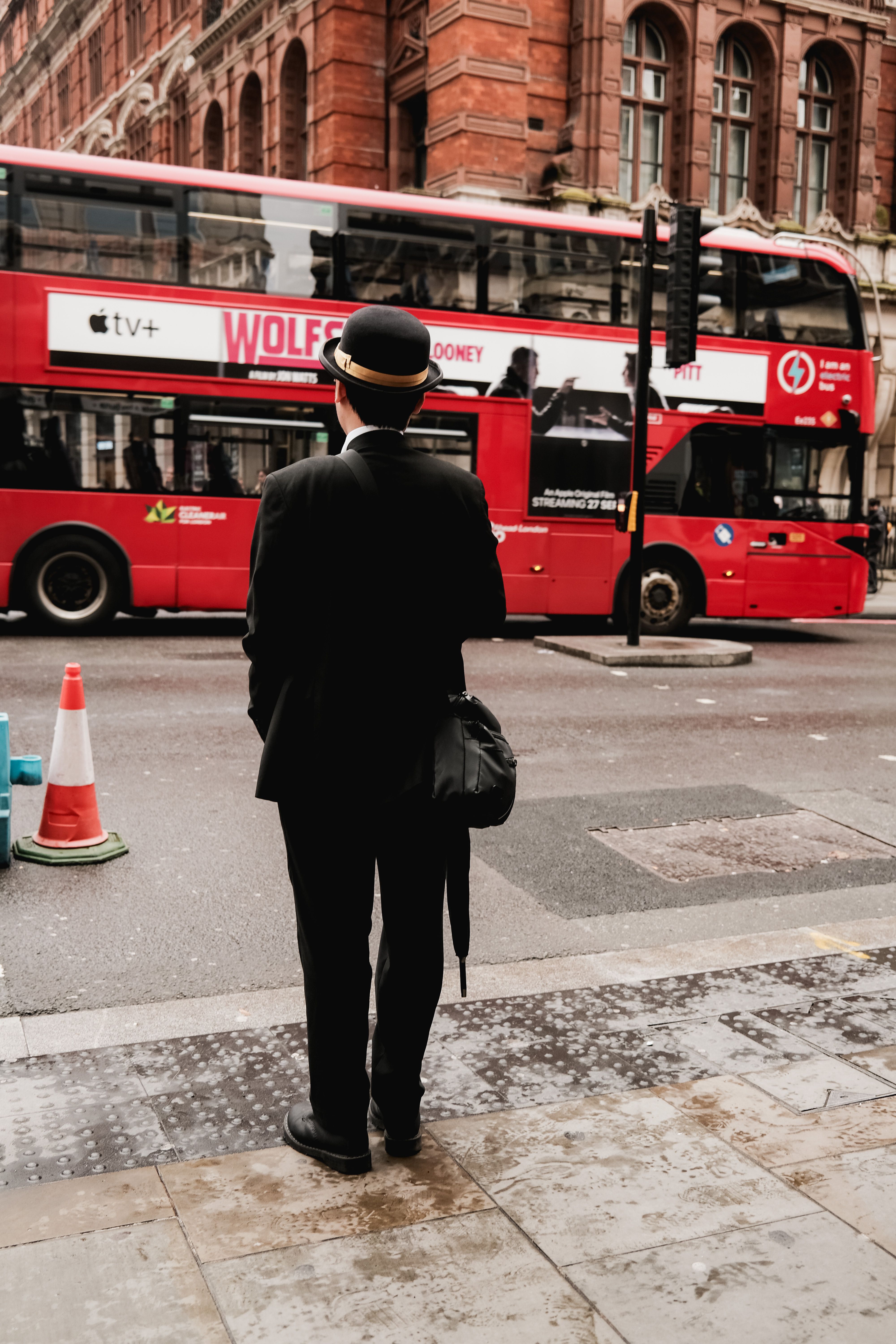 Man in Bowler Hat Watching London Bus · Free Stock Photo