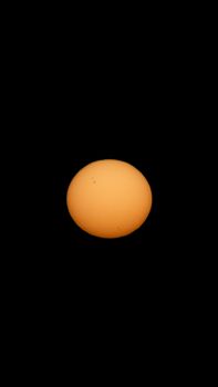 Detailed image of the sun showing sunspots against a black background.