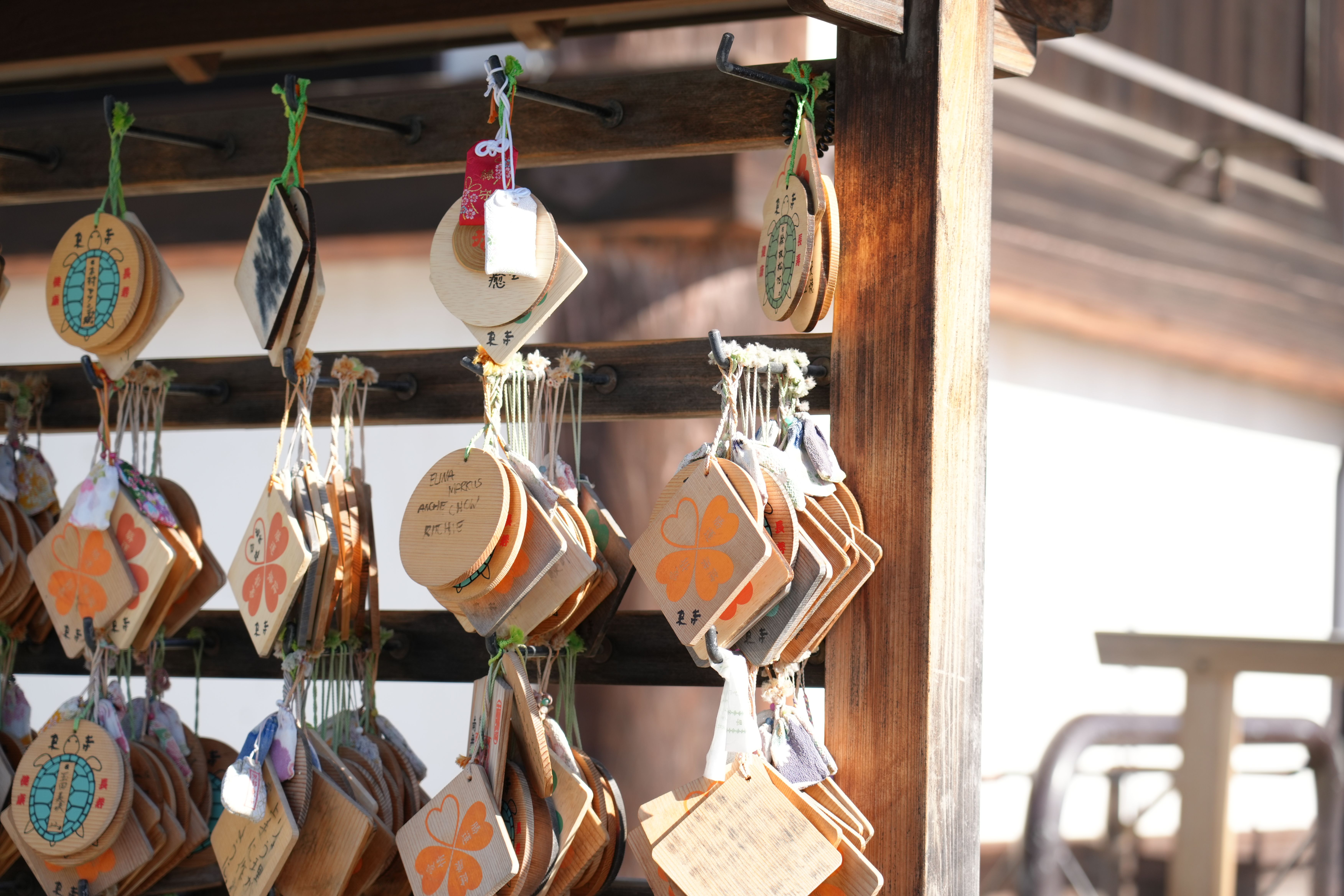 Ema prayer plaques hanging in a Kyoto temple, capturing traditional Japanese culture.