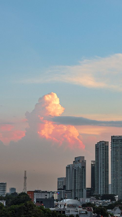Free Sunset city with pink sky White Clouds Stock Photo