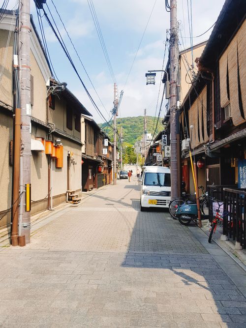 Free Explore a quiet traditional Japanese street with historical buildings and serene atmosphere. Stock Photo