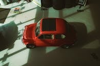 Aerial View of Vintage Red Fiat Car Indoors