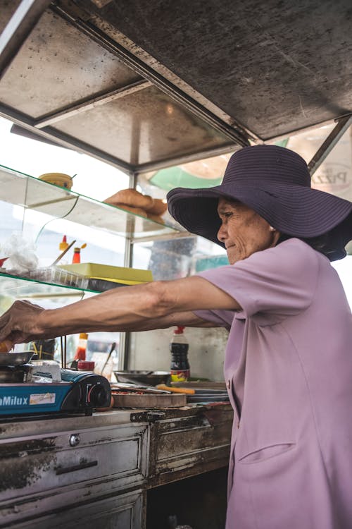 Photo Of An Old Woman Wearing Purple Top