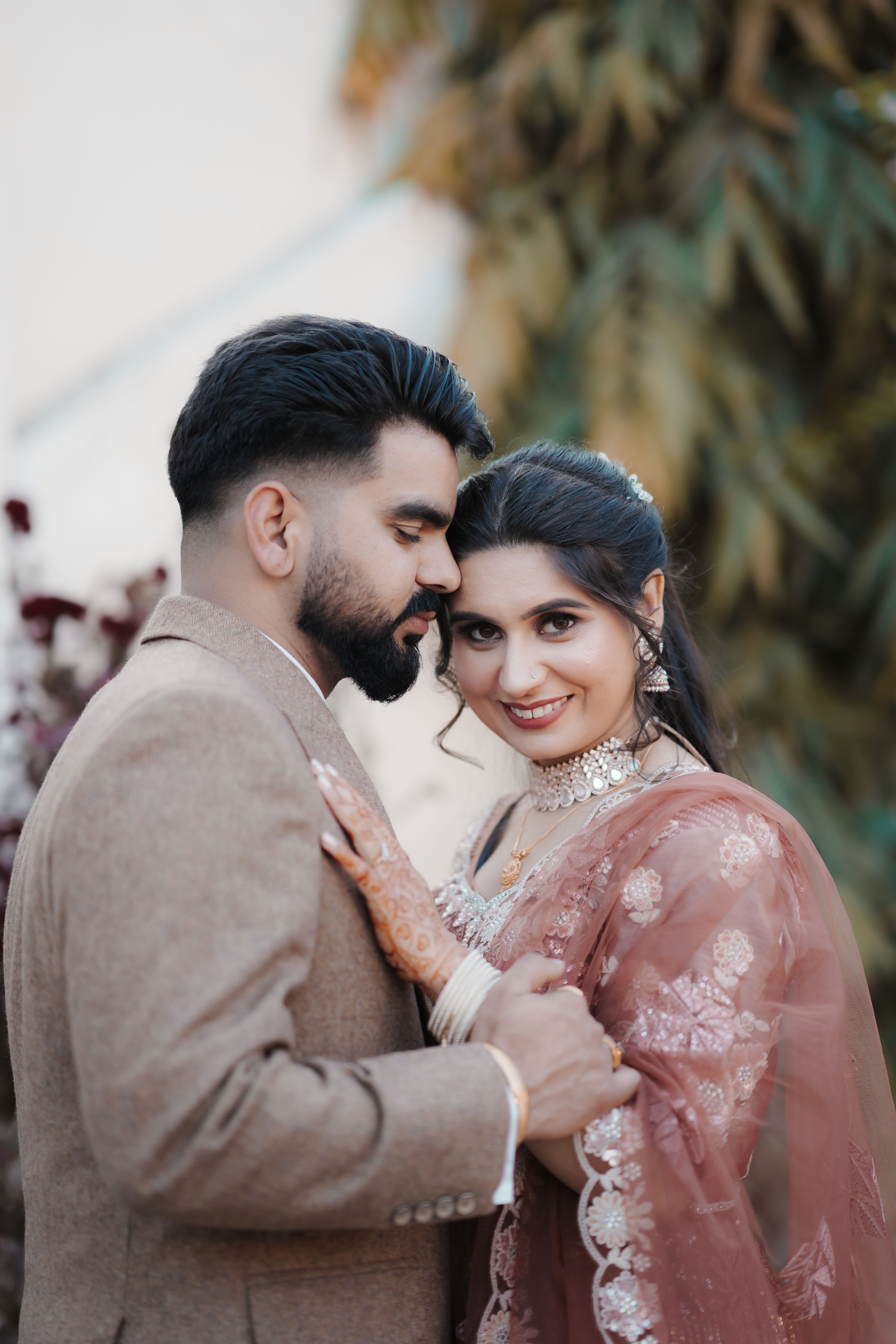 Elegant Couple Embracing in Traditional Attire · Free Stock Photo