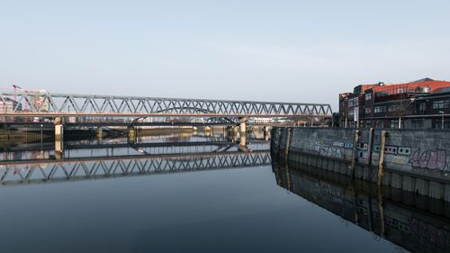Free Tranquil morning at the steel bridge in Hamburg with calm water reflections. Stock Photo