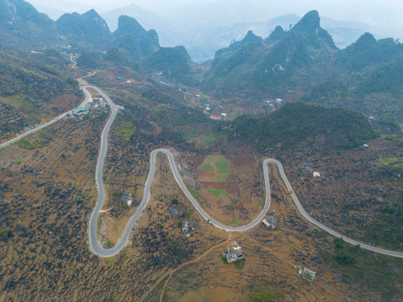 Mountain road in Ha Giang showing why small group travel needs careful operation