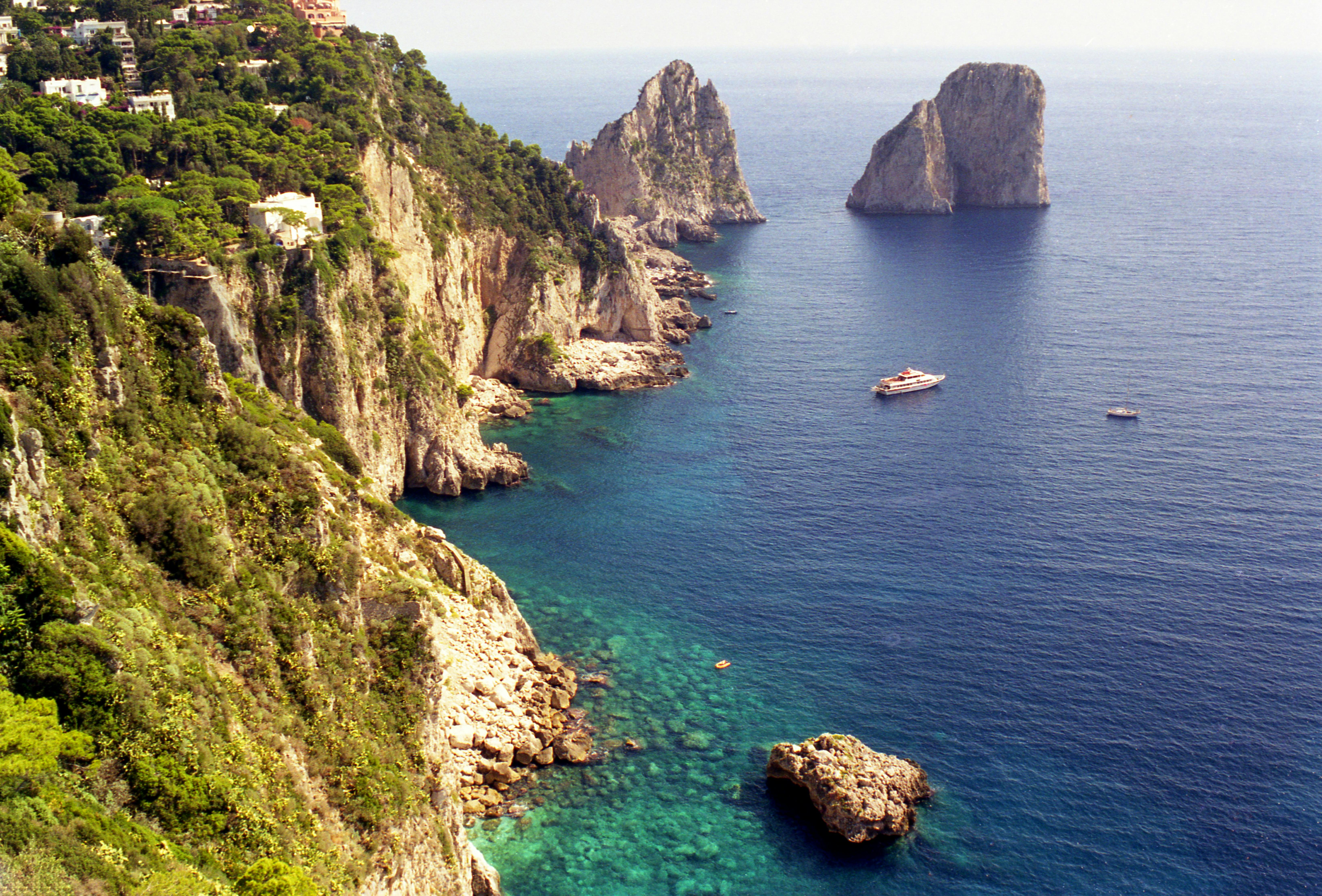 Breathtaking view of the cliffs and blue sea at the Isle of Capri, Italy. - Capri
