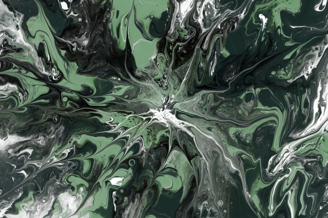 dynamic abstract painting in swirling green and white tones creating a