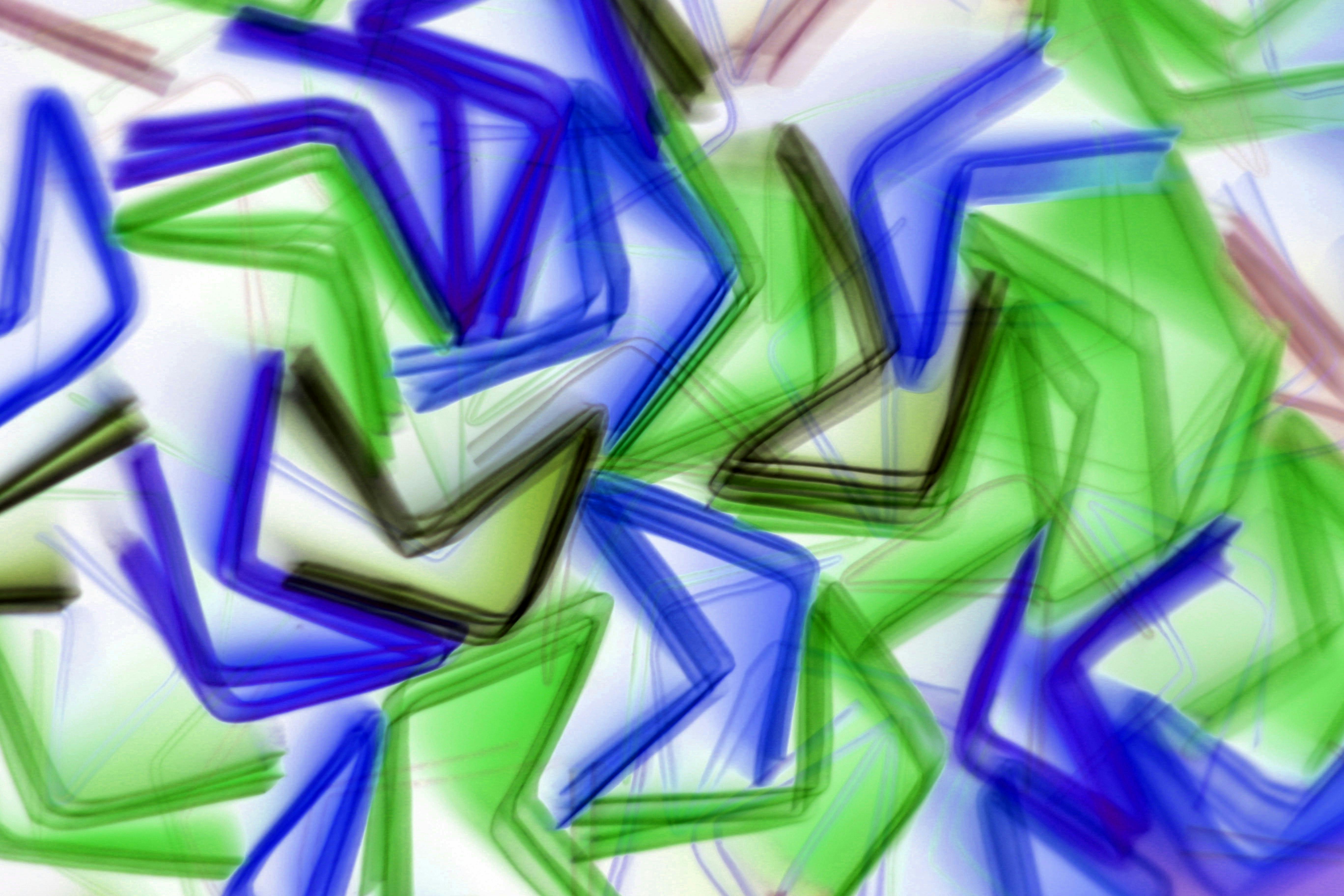 Free Vibrant abstract illustration with overlapping geometric patterns in blue and green, creating a dynamic visual effect. Stock Photo