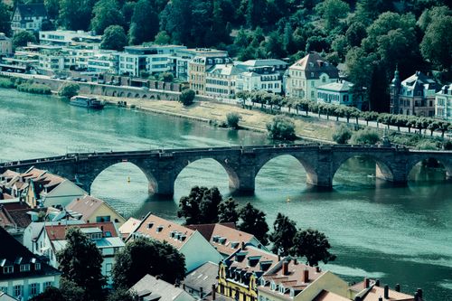Free Aerial view of the historic Old Bridge over the Neckar River in Heidelberg, Germany. Stock Photo