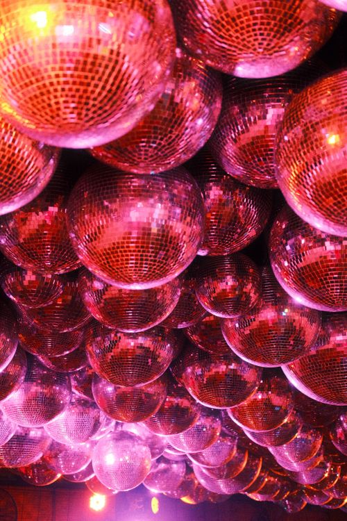 Free A dynamic array of shimmering disco balls creating a lively atmosphere. Stock Photo