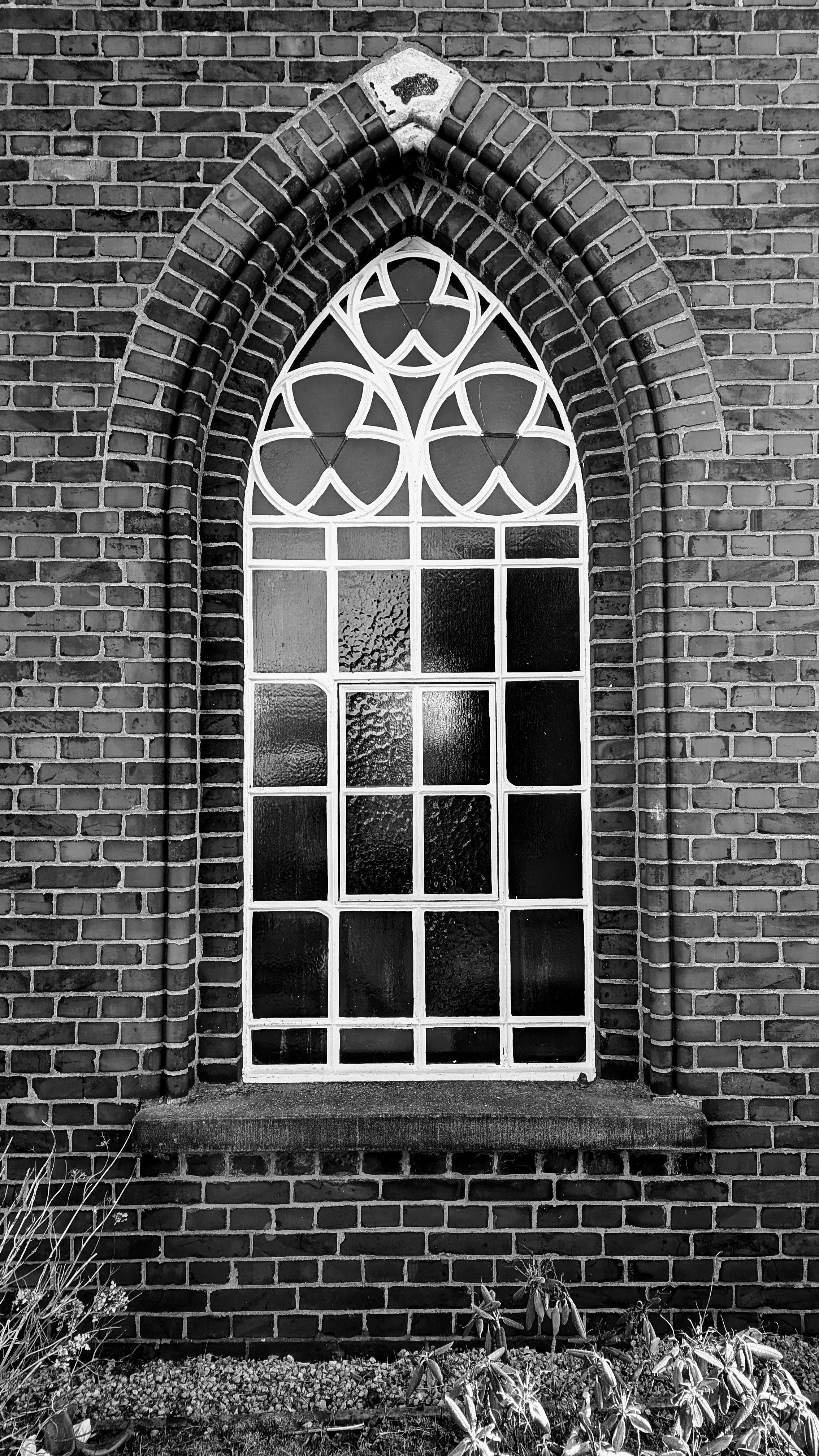 Gothic Arch Window in Red Brick Wall · Free Stock Photo