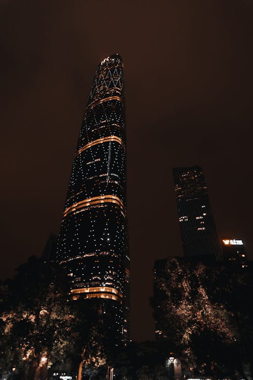 Low Angle Photo Of High-Rise Building During Nighttime