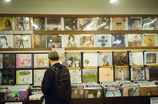 Young man browsing vinyl records in a vintage music store, exploring musical classics.