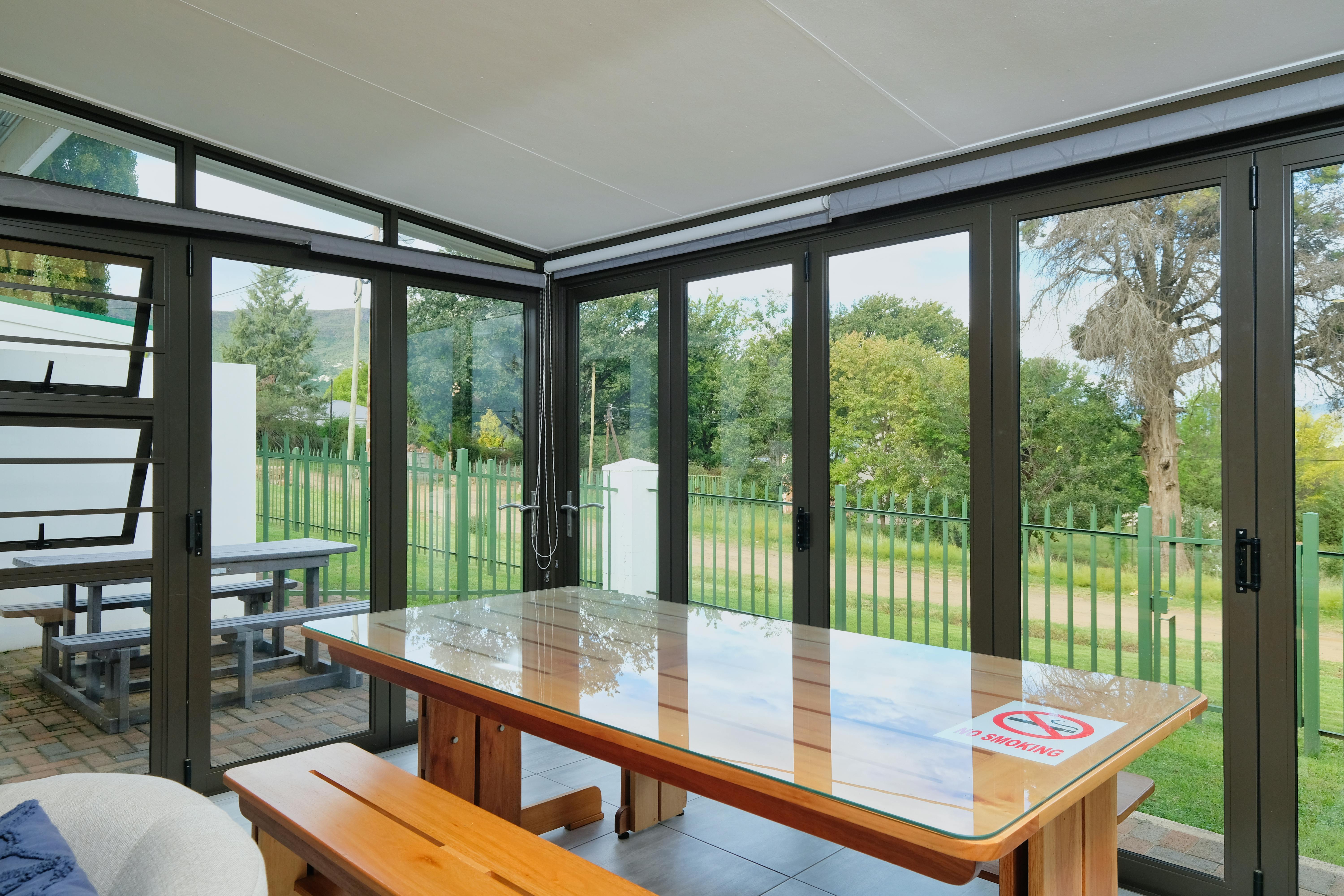 Glass-walled Breezespace connecting indoor and outdoor living areas - modern modular home designs