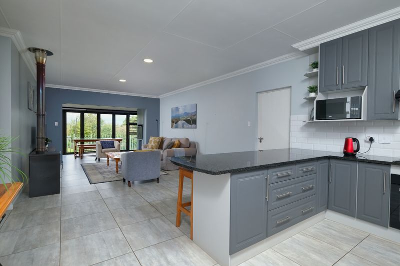 Bright modern open-plan kitchen and living area in a well-appointed home