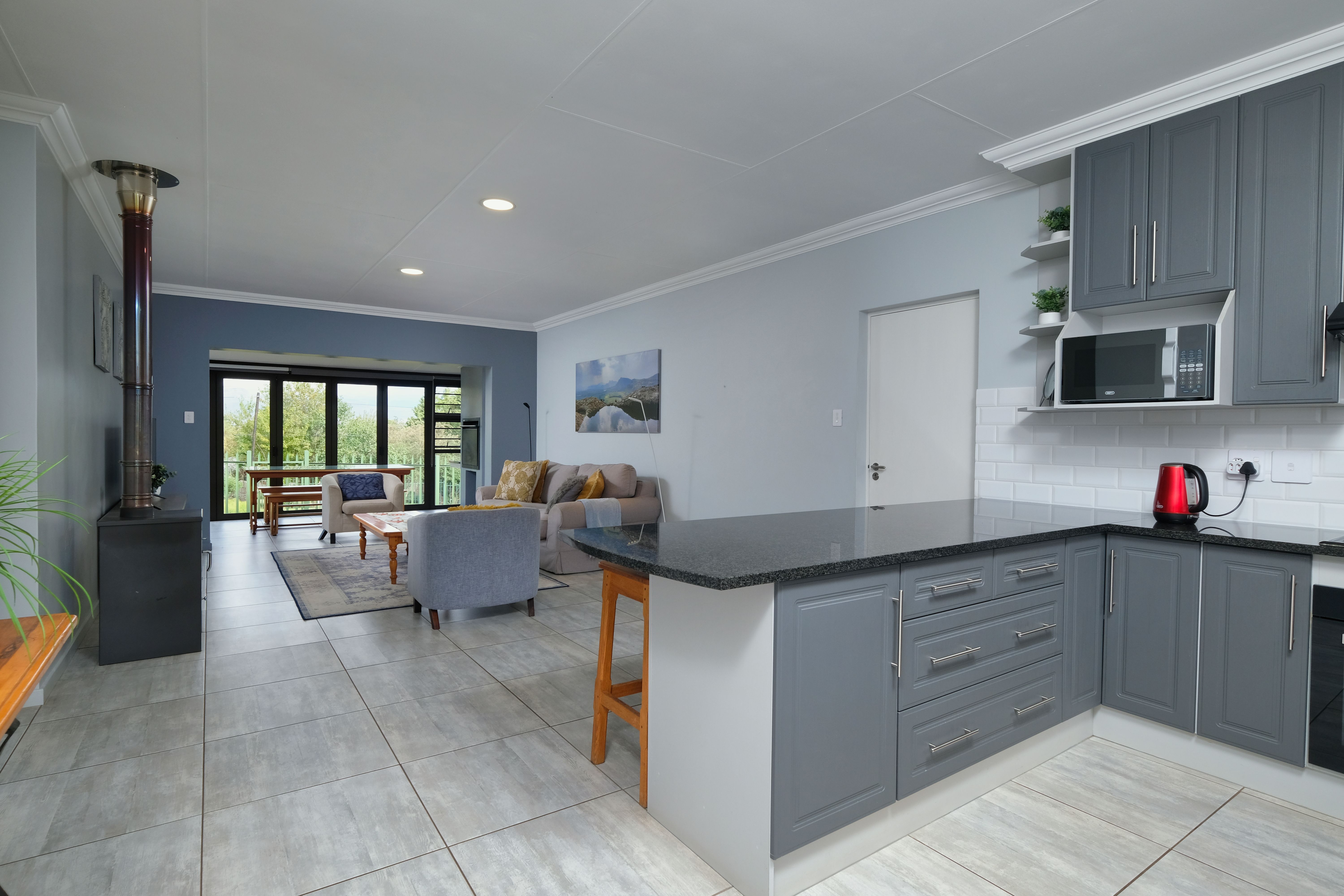Modern Open Floor Plan Kitchen and Living Area · Free Stock Photo
