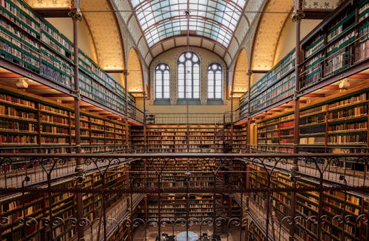 Explore the ornate and historic library interior at Amsterdam's Rijksmuseum, filled with ancient books and architectural beauty.