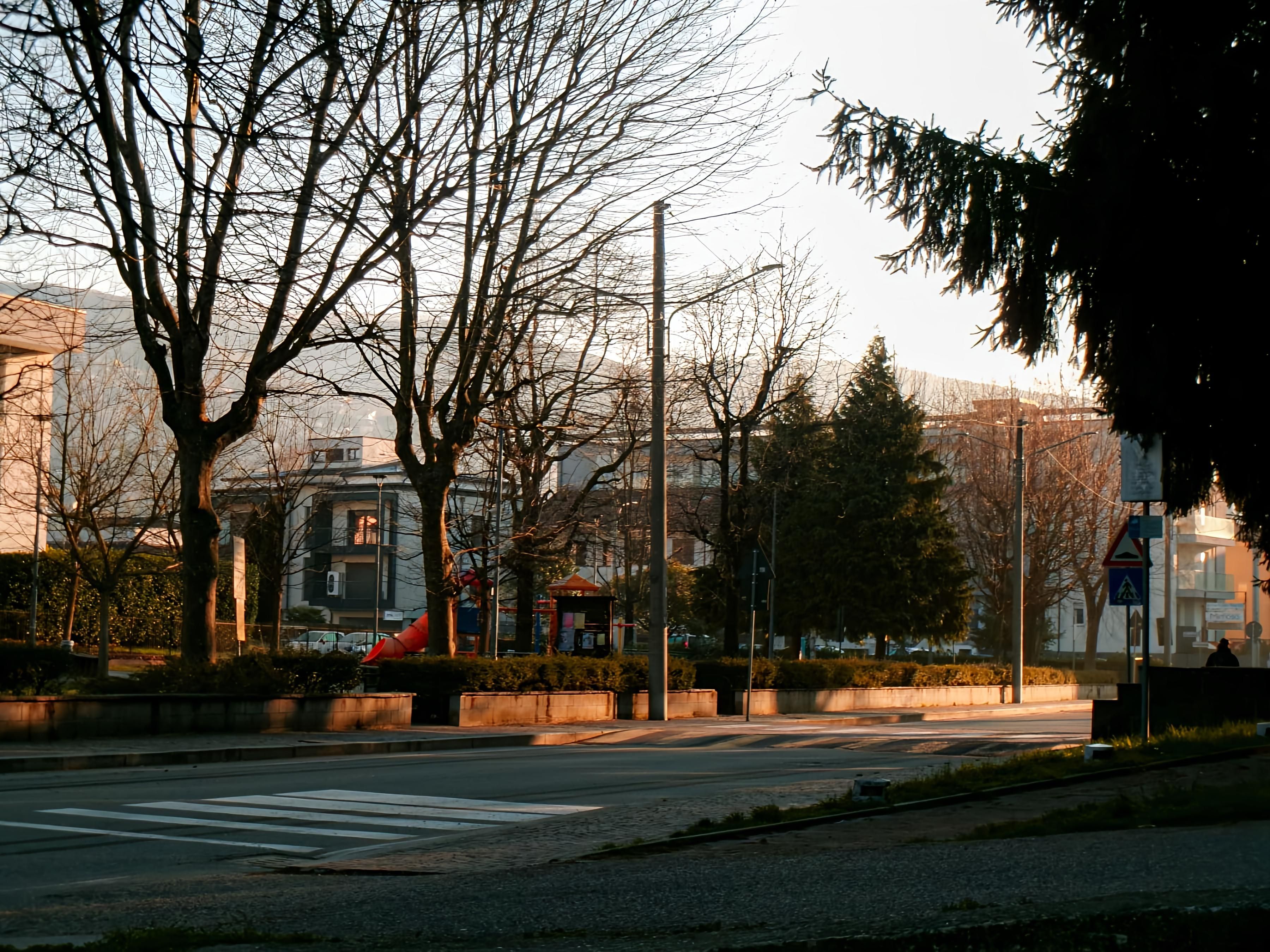 A peaceful street scene in Lipomo, Lombardia, Italy during golden hour.