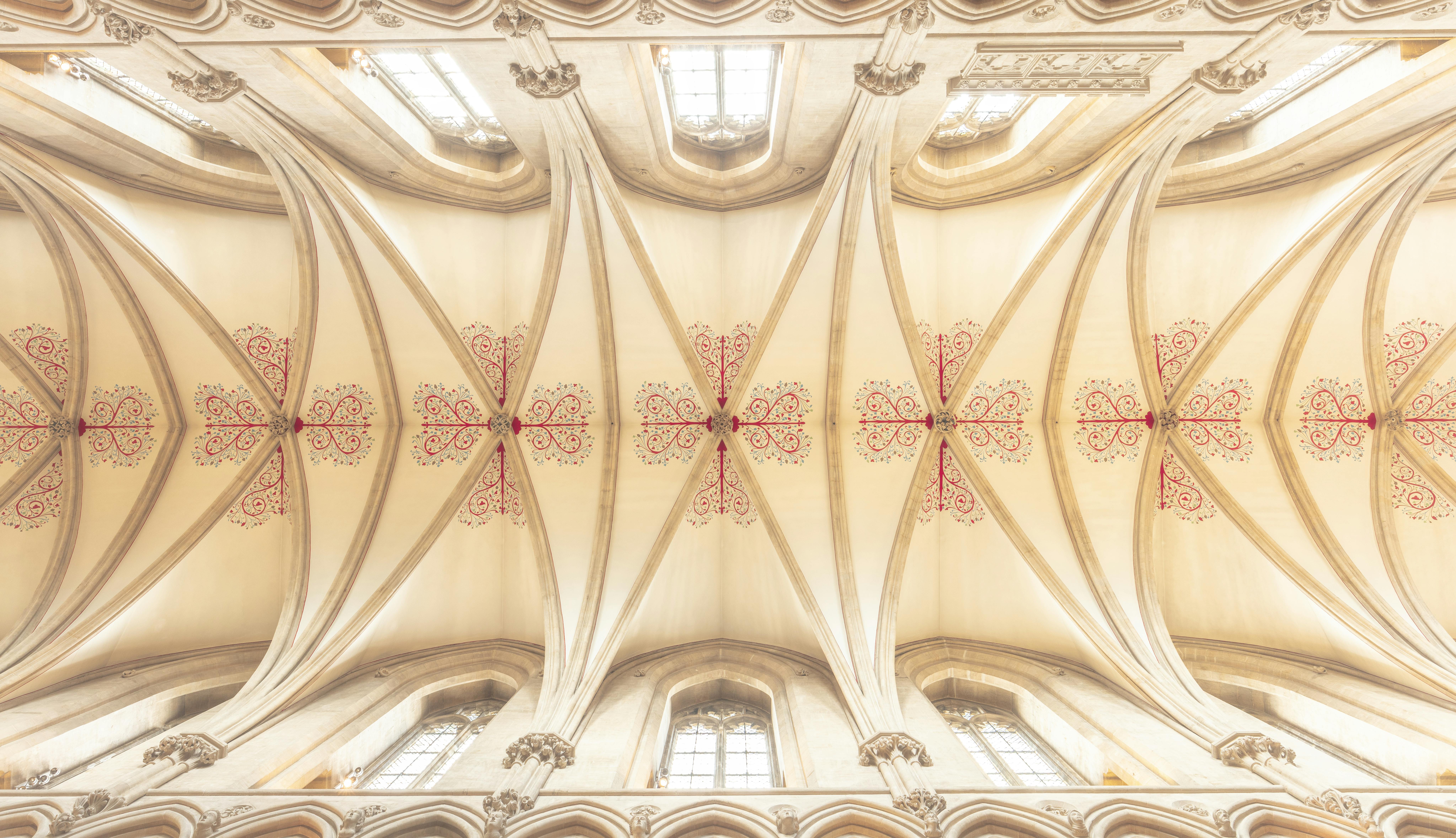Intricate Gothic ceiling design inside Wells Cathedral, showcasing historical architecture.