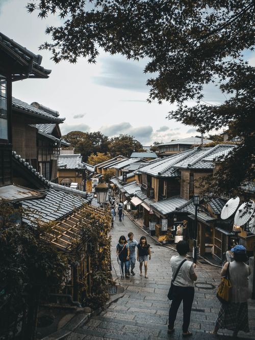 Free Explore the charming historic streets of Kyoto with traditional architecture and vibrant atmosphere. Stock Photo