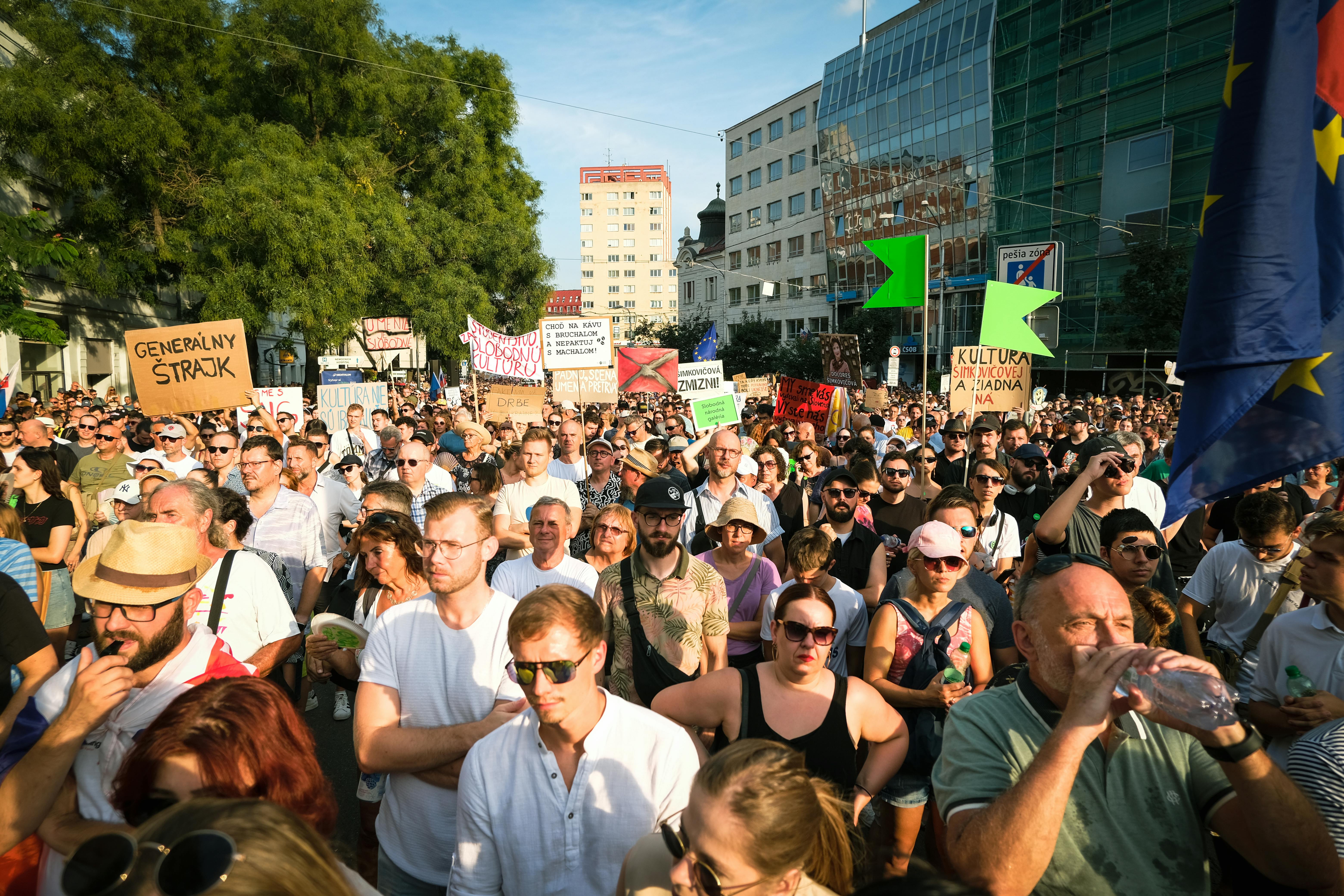 A diverse crowd peacefully protesting in Bratislava, Slovakia, showcasing cultural unity and civic engagement.
