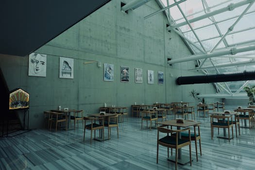 A contemporary cafe in Ankara featuring minimalist design and artistic wall decor, offering a stylish dining atmosphere.