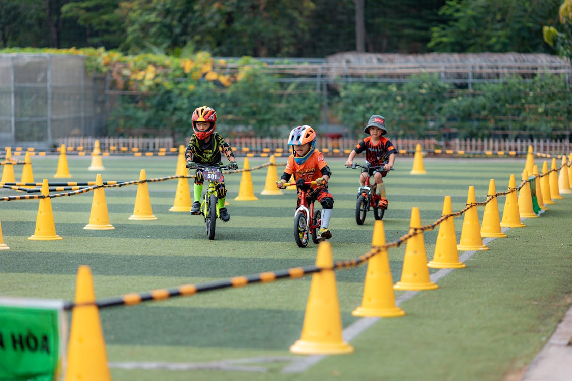 Kids Cycling Race in Outdoor Park ยท Free Stock Photo