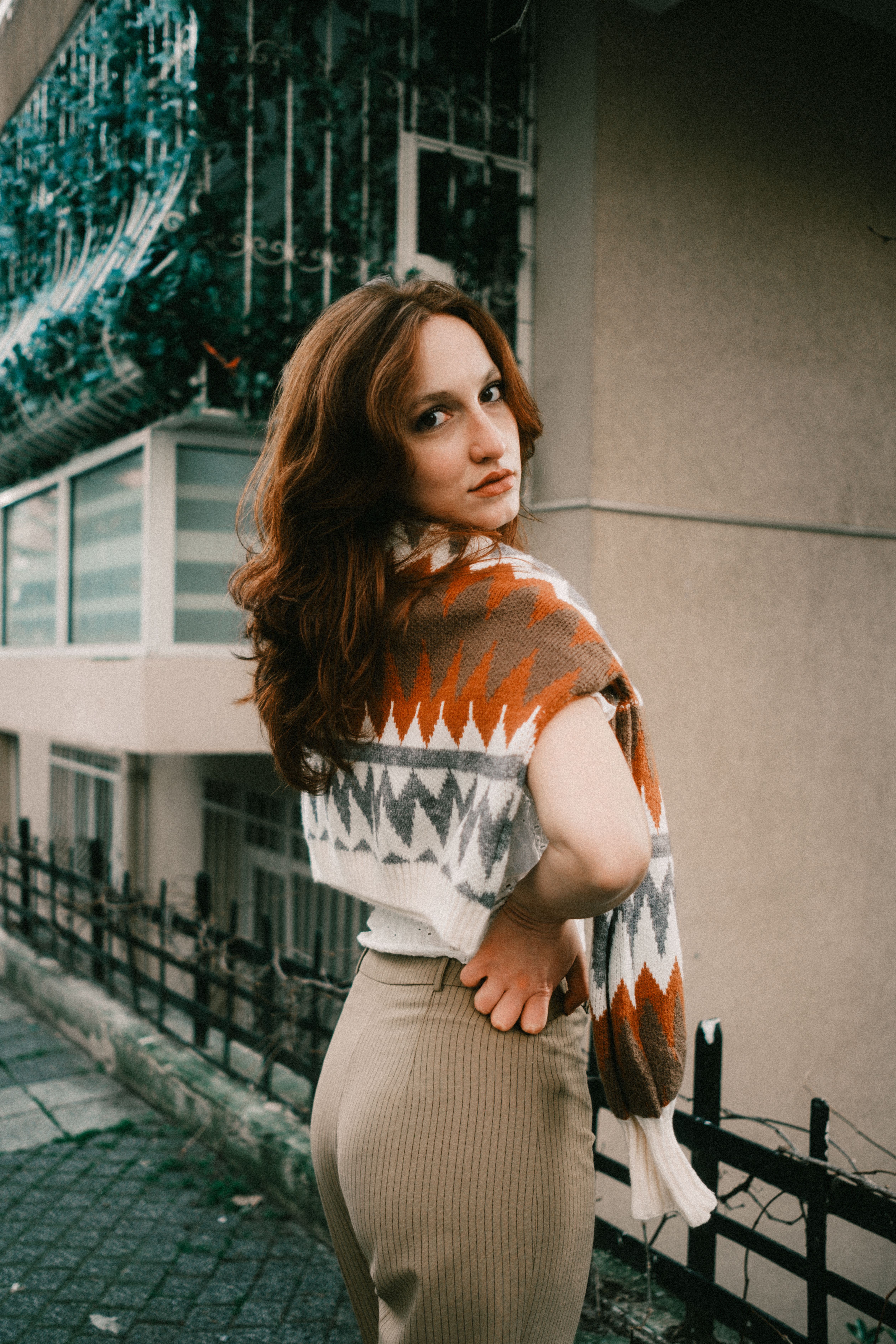 Woman in colorful patterned poncho