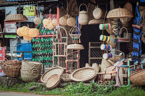 Free Explore the vibrant display of handcrafted wicker and cane products in a Sri Lankan market stall. Stock Photo
