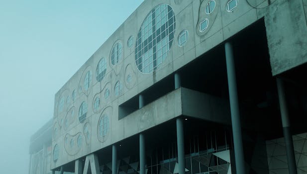 Foggy view of Musikkens Hus in Aalborg, Denmark showcasing modern design.