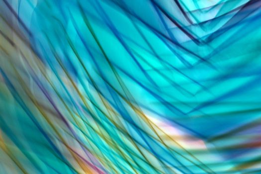 A vibrant abstract image with flowing blue and green patterns, creating a dynamic visual effect.