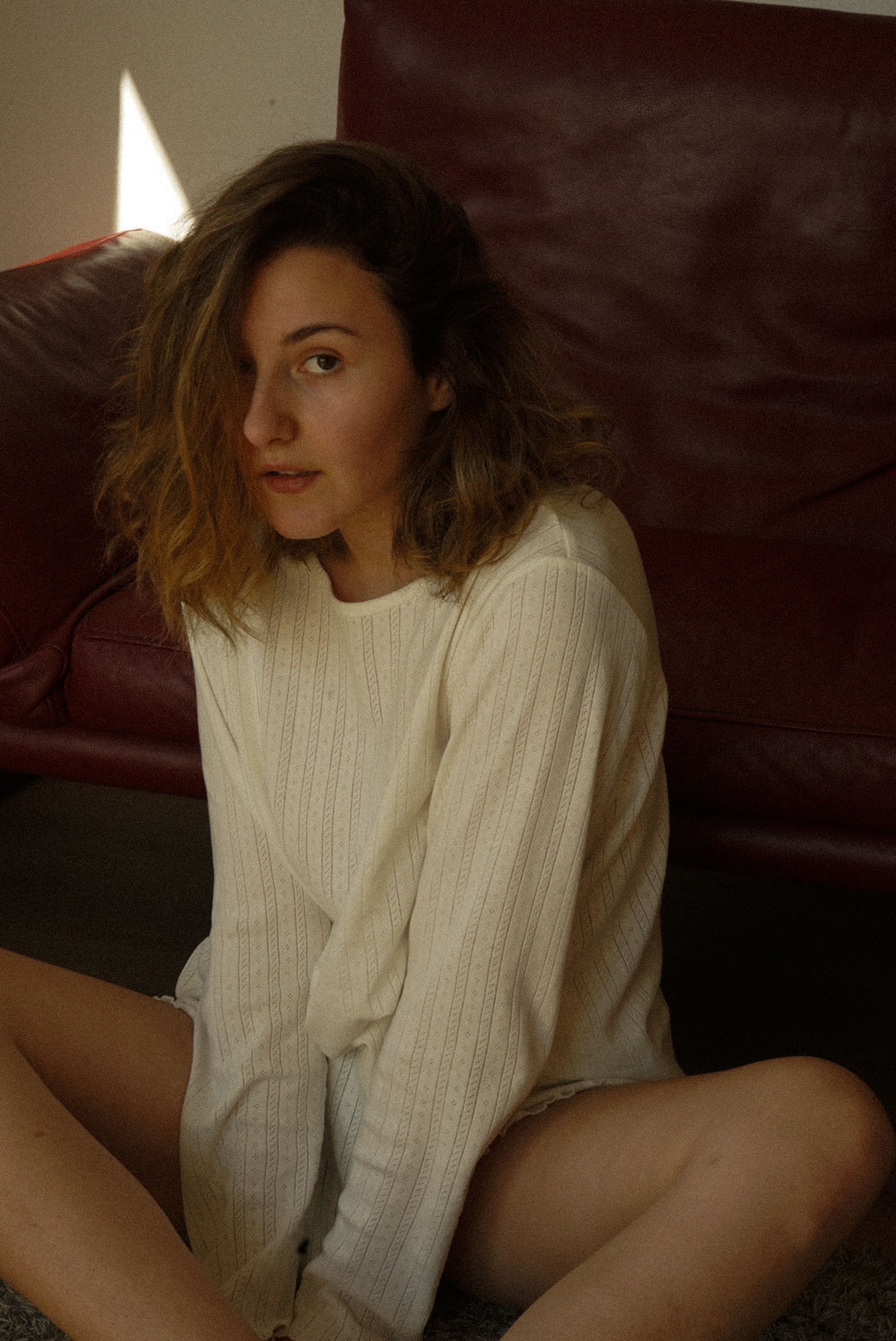 Casual Sitting Portrait in Relaxed Setting · Free Stock Photo