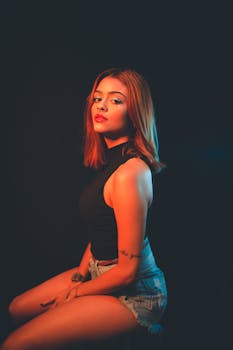 Elegant woman in a studio setting, showcasing fashion and style.