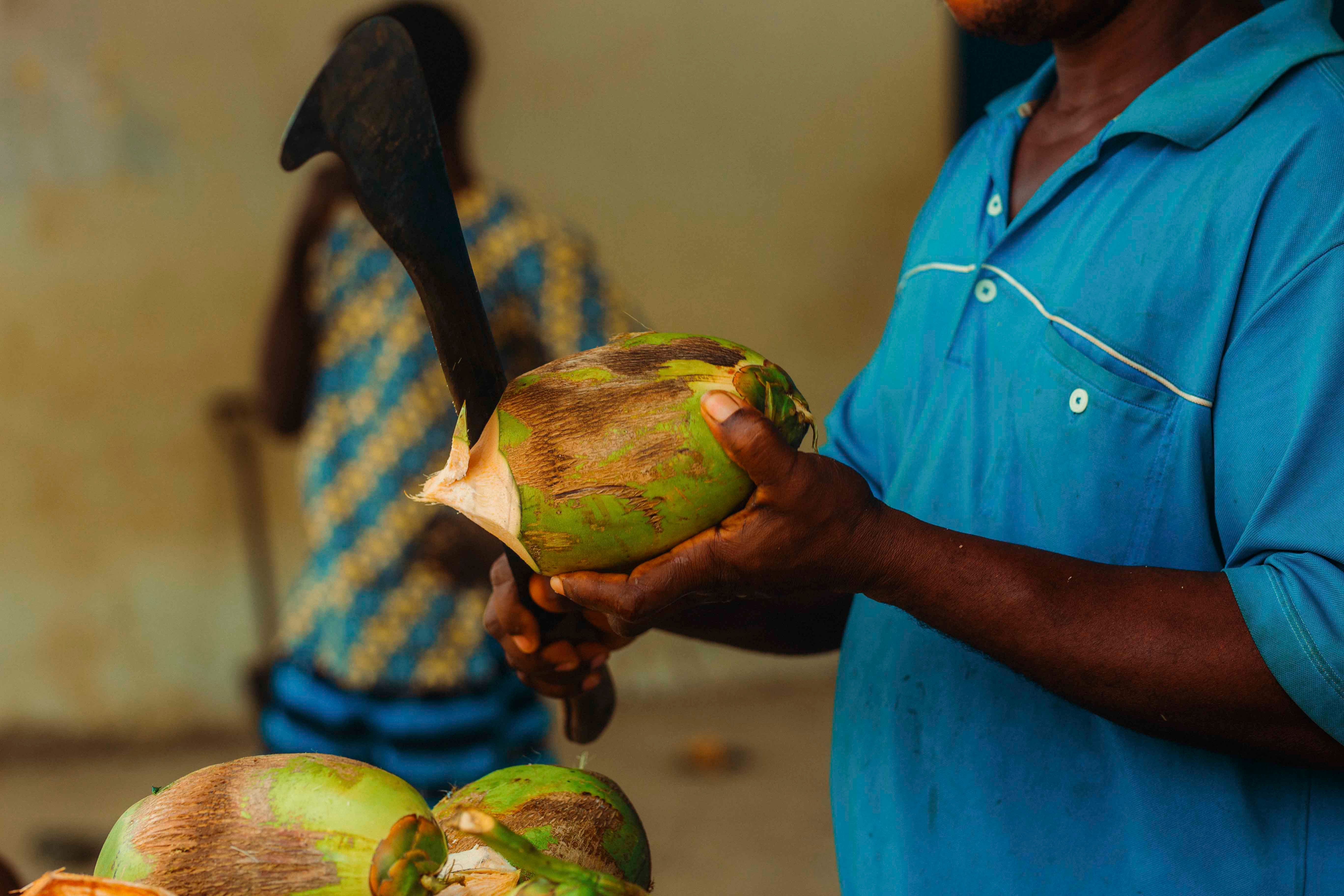 Traditional Coconut Preparation in Ghana Market · Free Stock Photo
