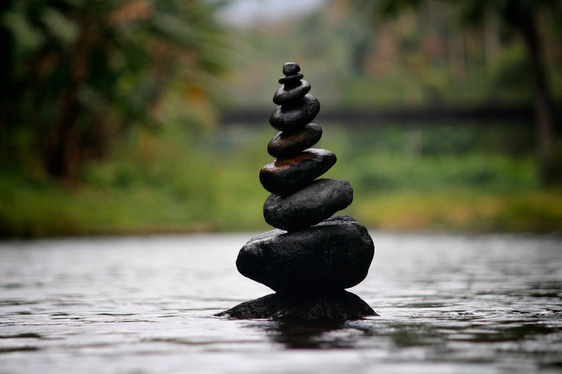 Free Black Stackable Stone Decor at the Body of Water Stock Photo