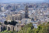 Aerial view capturing the historic Málaga Cathedral amidst the cityscape in Andalucía, Spain.
