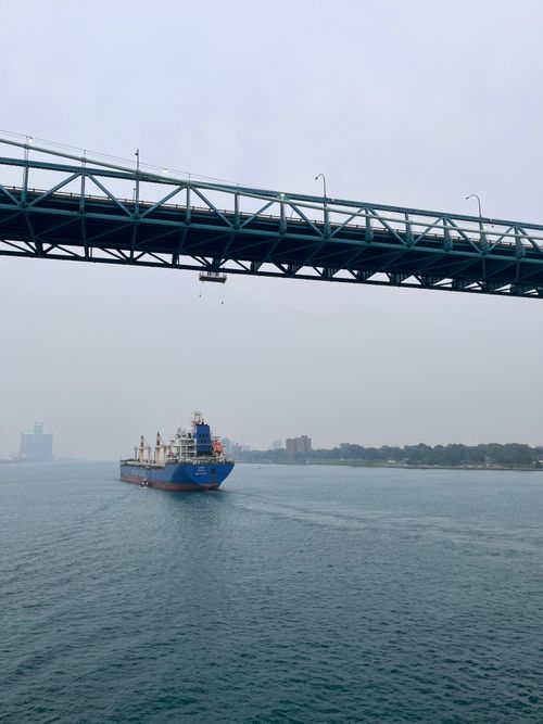 Free A cargo ship sails under the Ambassador Bridge on a foggy day in Detroit. Stock Photo