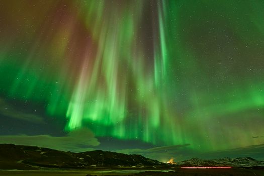 Stunning view of the Northern Lights illuminating the Icelandic sky at night.