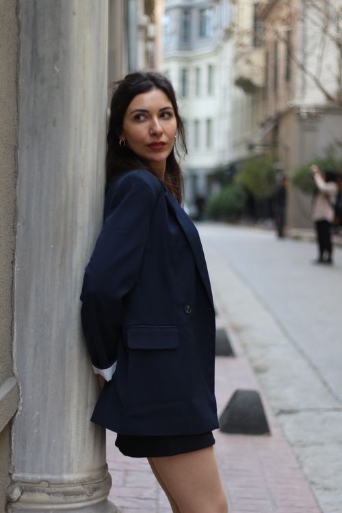 Free Stylish woman in navy blazer posing on a charming street in İstanbul, Türkiye. Stock Photo