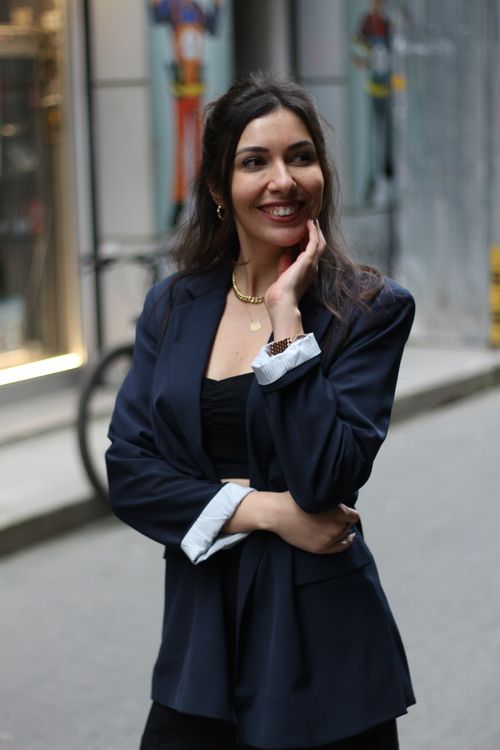 Free Fashionable woman smiling on İstiklal Street, Istanbul, capturing urban elegance. Stock Photo